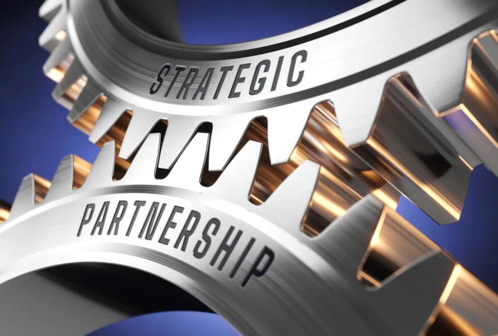 Close-up of interlocking gears labeled 'Strategic' and 'Partnership'.