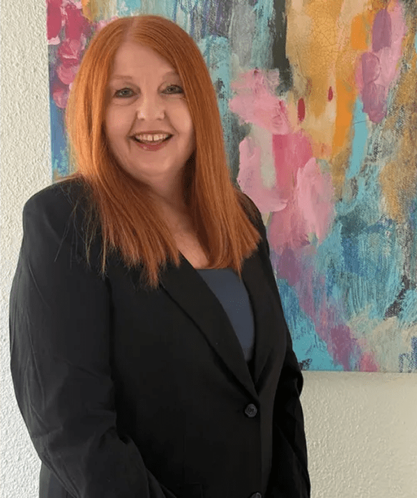 Businesswoman posing near abstract art